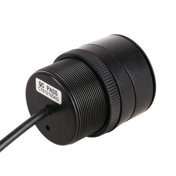 Rear view camera module with textured ring lens and circular mounting face