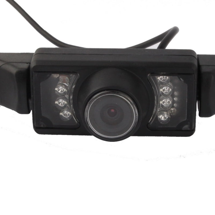 Car rear view camera front with central lens and four LED light windows, black