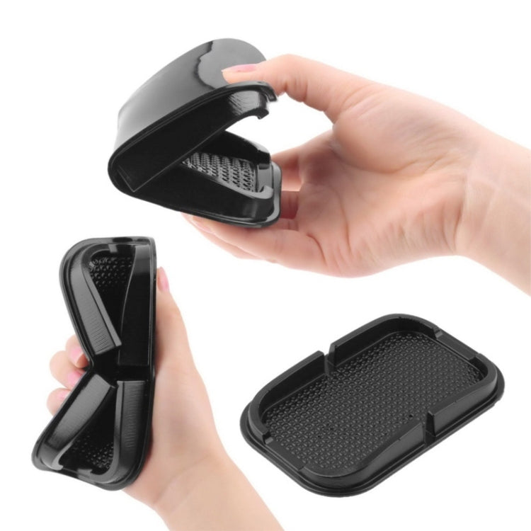 Universal smartphone holder with adjustable arms and textured insert, shown in use