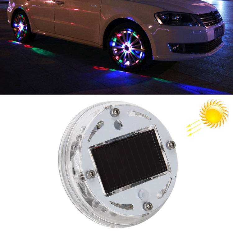 Car wheel solar LED light with multicolor flashing glow around the rim