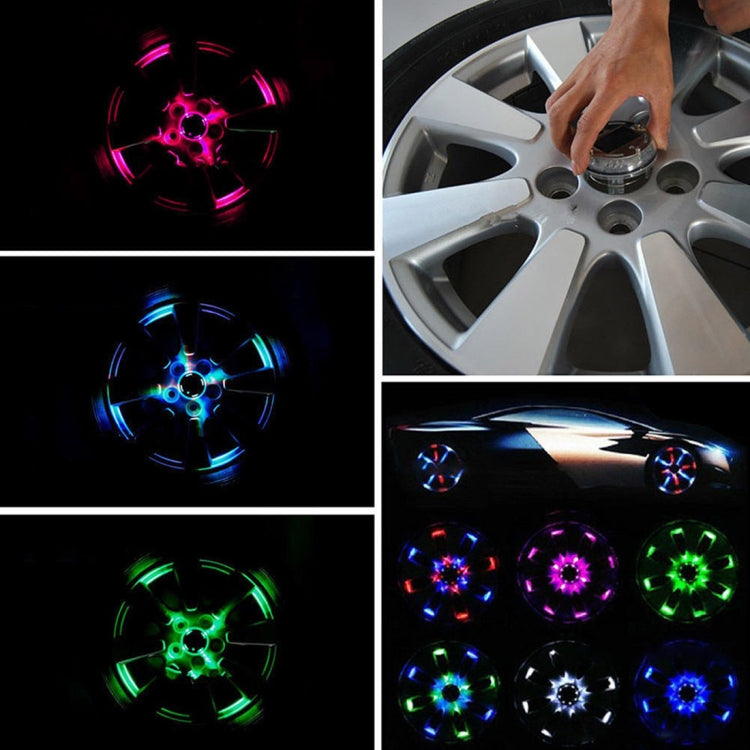 Multicolor solar wheel LED light glow, shown installed on a car wheel
