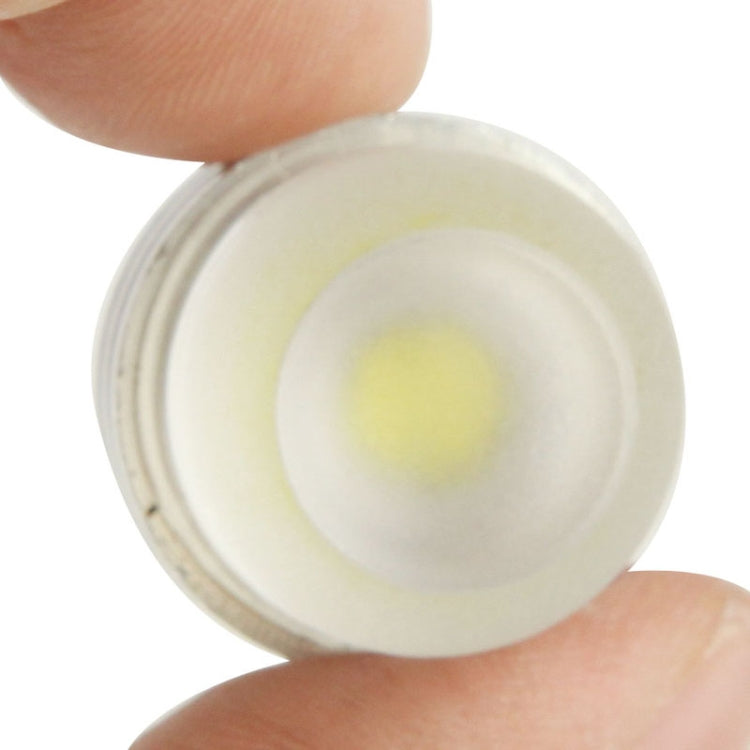 Close-up of DC 12V LED lens showing internal yellow light-emitting chip