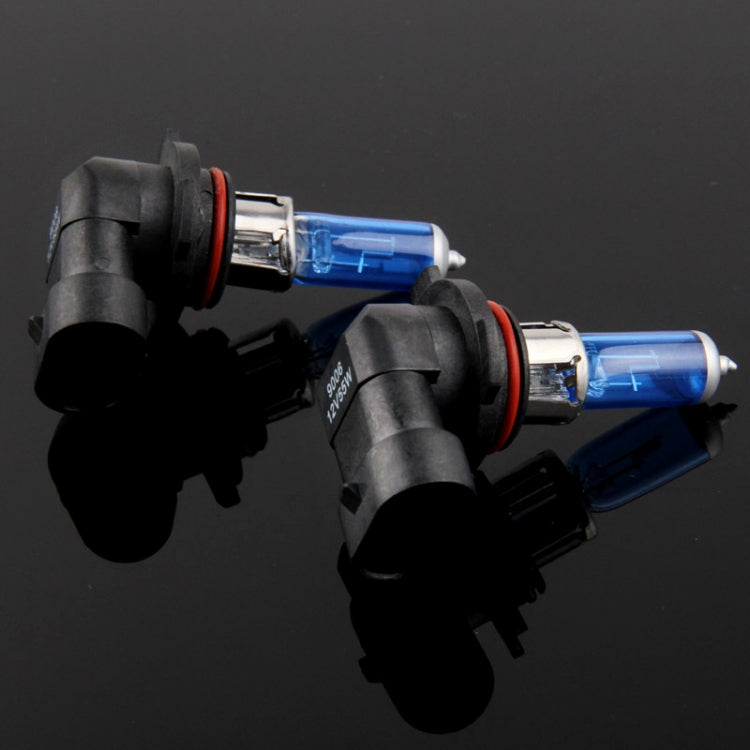 Two blue halogen headlight bulbs angled view with black connectors and red rings