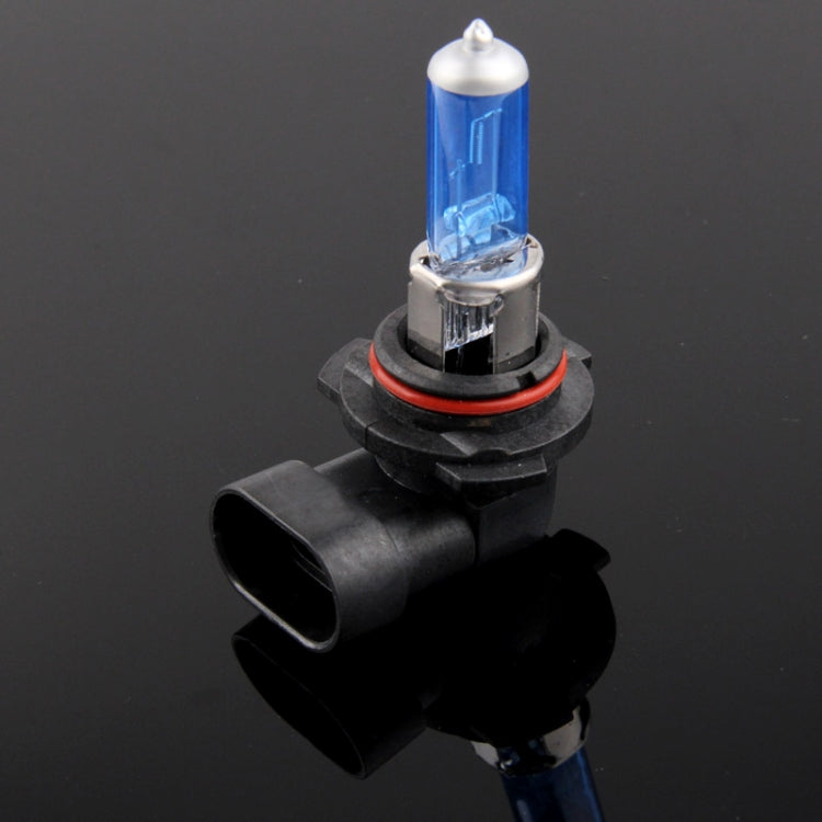 Blue halogen headlight bulb with clear tip, black base, and red ring