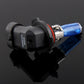 Halogen headlight bulb close-up with blue glass tube and black socket housing