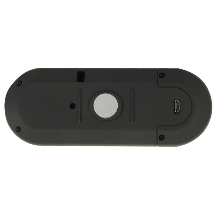 Black underside Bluetooth hands-free speakerphone with port and mounting screws