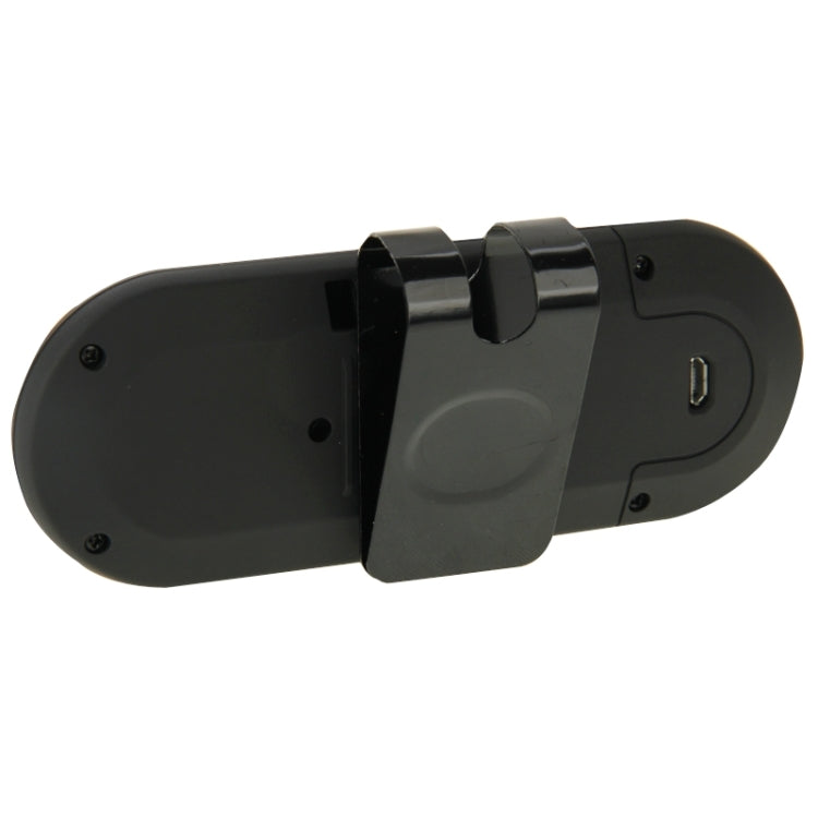 Black Bluetooth hands-free speakerphone with clip mount on the back, side view