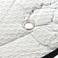 Silver reflective sunshade material with grommet eyelet detail for securing