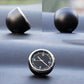Round mini dashboard clock with black face, silver bezel, and white time markers