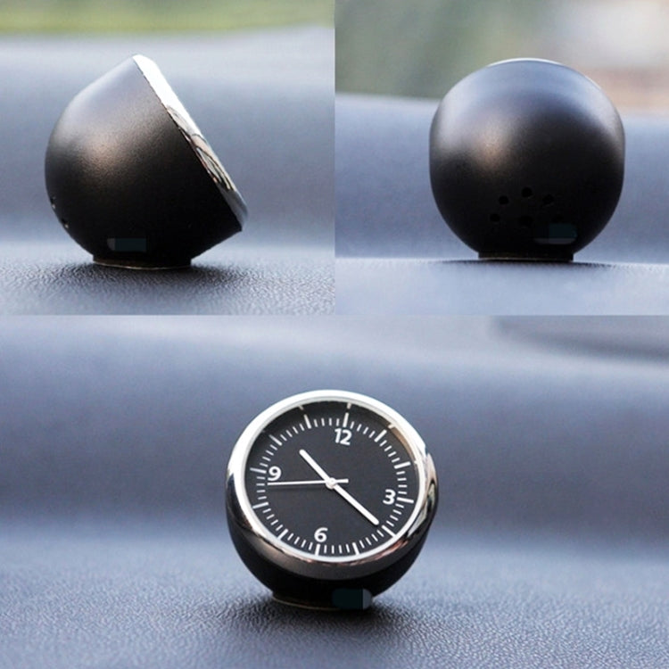 Round mini dashboard clock with black face, silver bezel, and white time markers