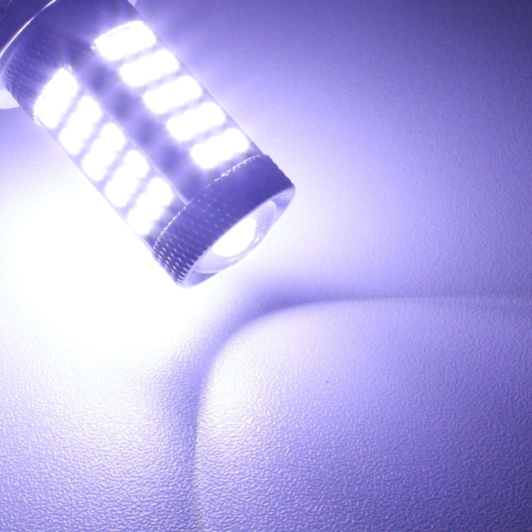 Lit 1156 LED bulb emitting bright white light from SMD array