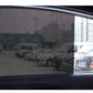 Close-up of gray perforated mesh UV sticker on car window glass