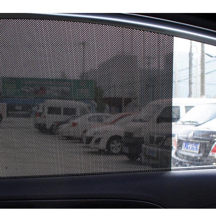 Close-up of gray perforated mesh UV sticker on car window glass