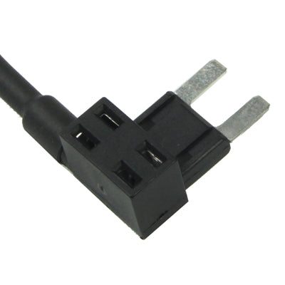 Close-up of black fuse tap base with two metal blades on red cable