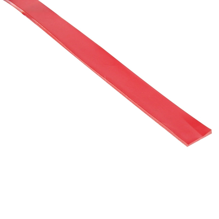 Double-sided adhesive tape strip, red translucent tape in a straight length