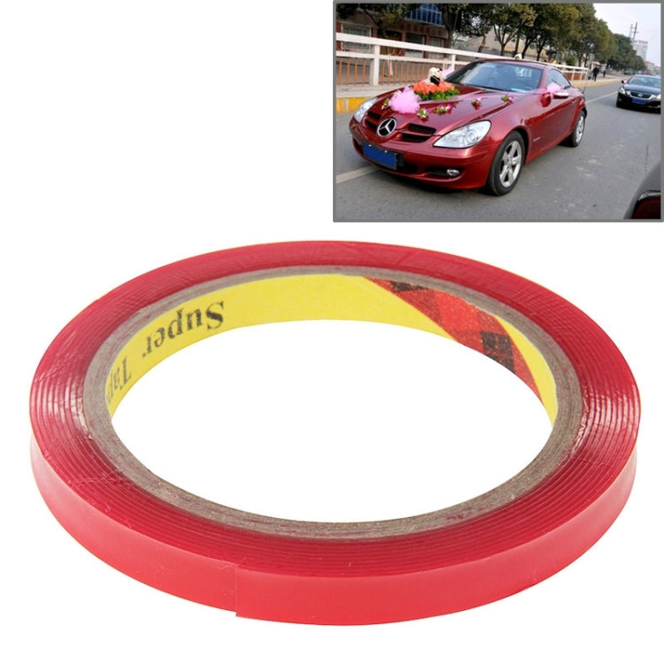 Red double-sided adhesive tape roll with exposed inner backing layer