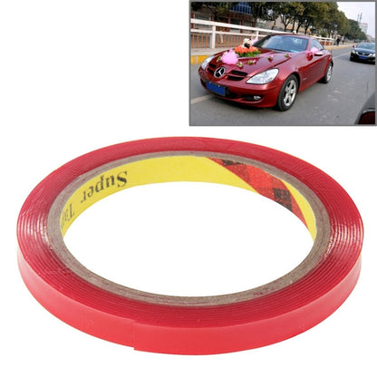 Red double-sided adhesive tape roll with exposed inner backing layer