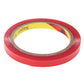 Red adhesive tape roll, top view showing inner ring and textured outer surface
