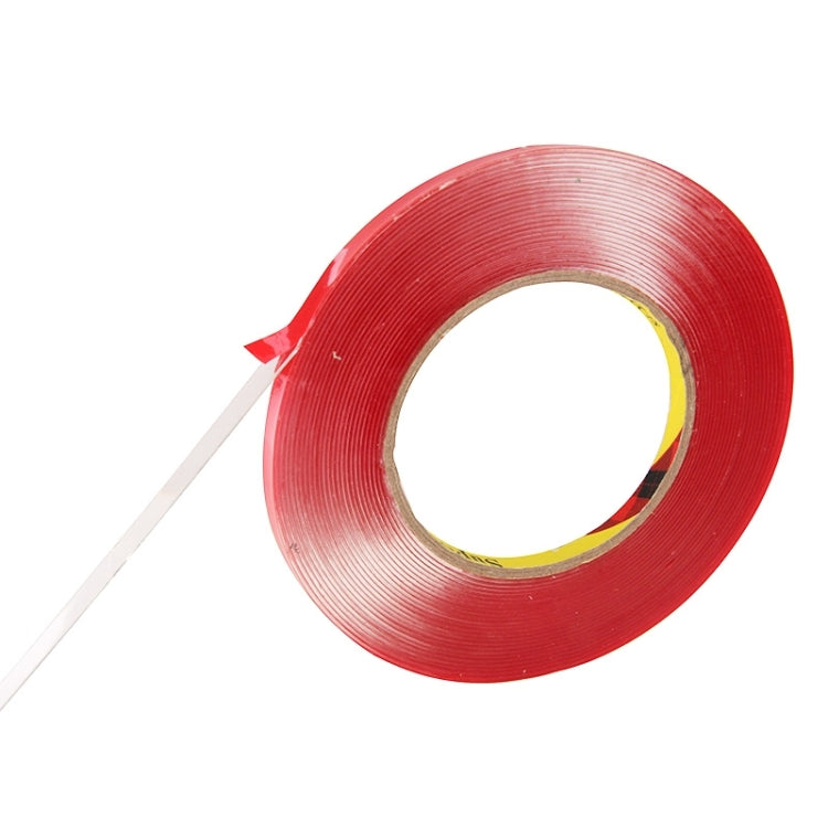 Red double-sided adhesive tape roll with tape end pulled out