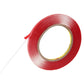 Red double-sided adhesive tape roll with loose tape end strip