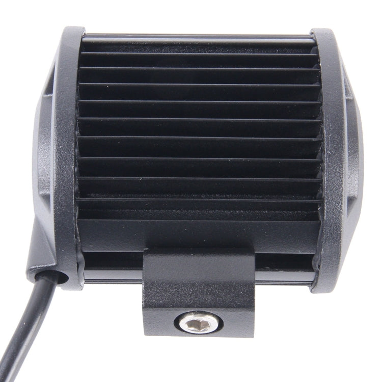LED work light with black heat-sink side fins and mounting base, 6-LED style.