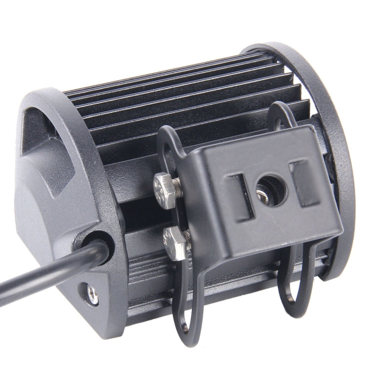 Black LED work light with metal mounting bracket and attachment hardware.