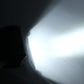 White LED light beam projecting in a dark area.