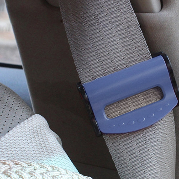 Blue car seat belt adjuster clamp fitted on a gray seat belt strap