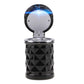 Black diamond-pattern car ashtray with open lid and glowing blue LED light