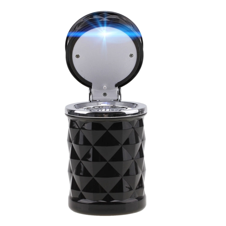Black diamond-pattern car ashtray with open lid and glowing blue LED light