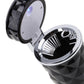 Close-up of open black diamond-pattern car ashtray with silver rim and LED light cover