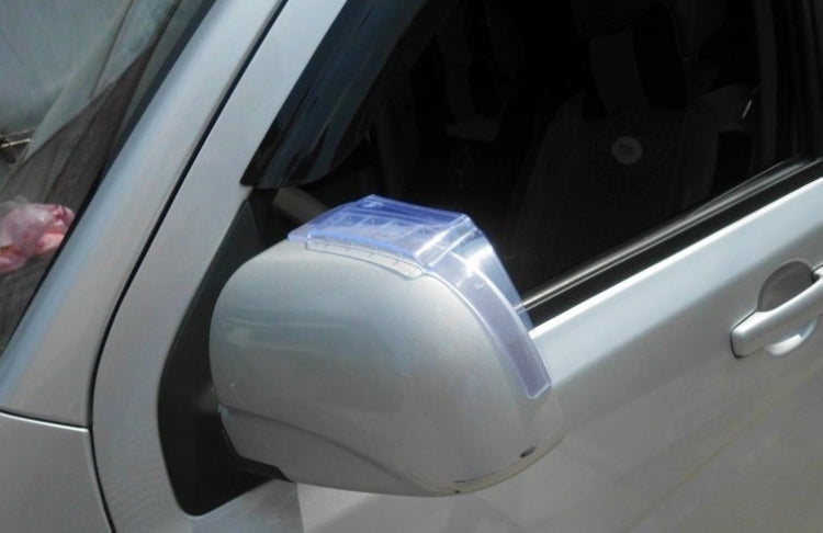 Installed transparent rain shield on car side mirror with flexible cover