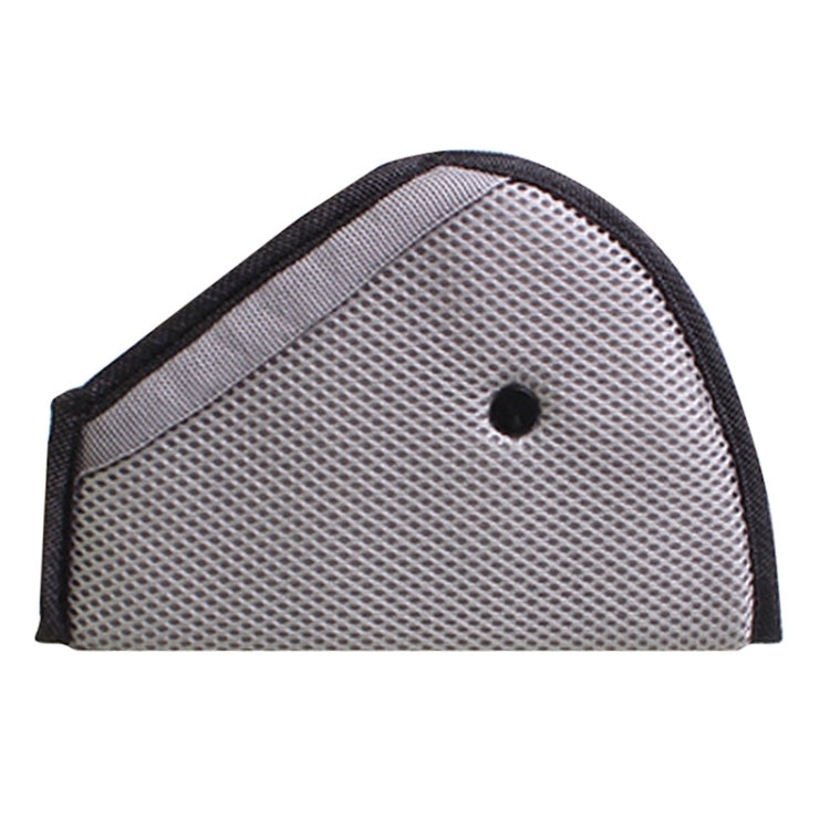 Grey mesh car seat belt adjuster pad with black edging and small center hole