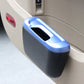 Blue and black mini car storage bin beside dashboard compartment