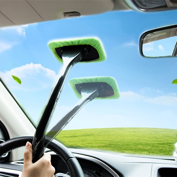 Windshield cleaner with green microfiber pads attached for wiping car glass