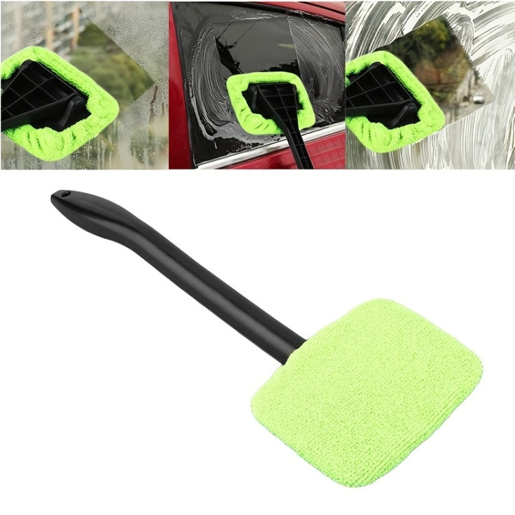 Windshield cleaner tool with green microfiber pad on a black handle