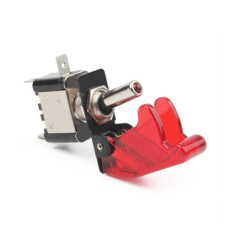 Red flip-cover arming switch with black base and metal switch lever