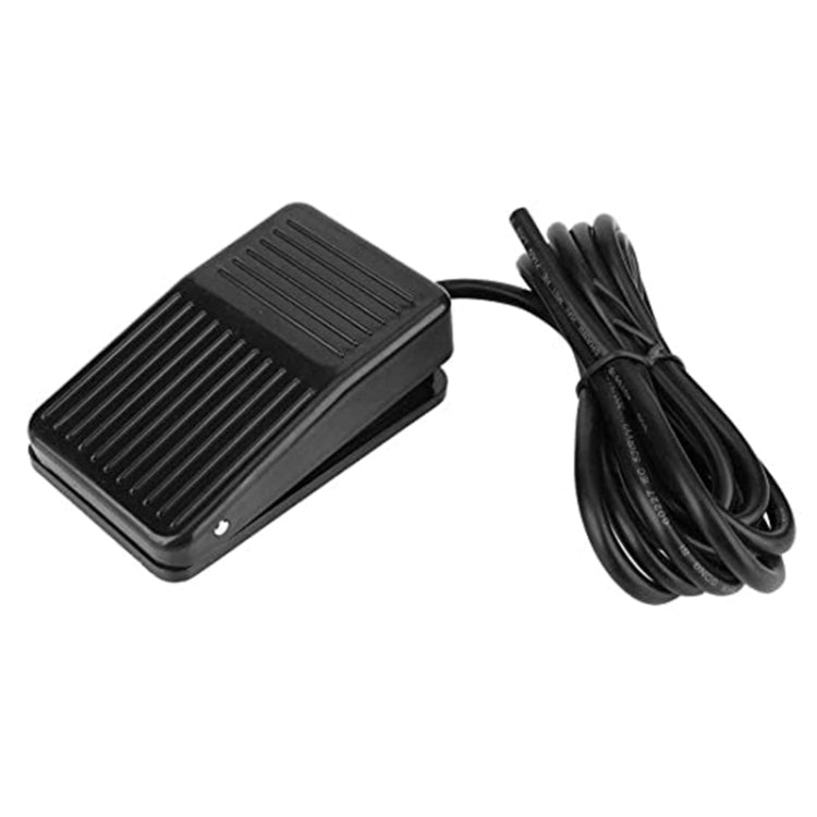 Black plastic foot pedal switch with cable, slotted anti-slip top