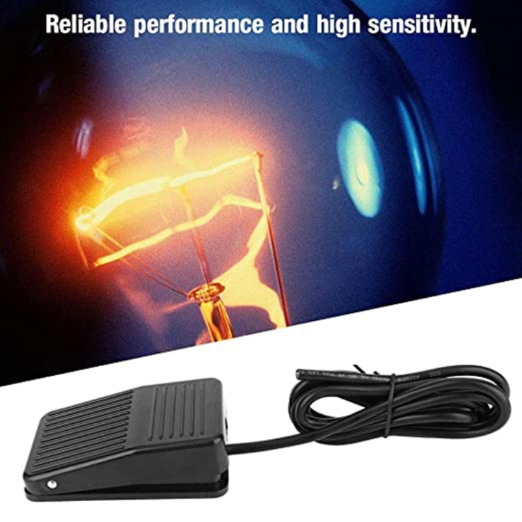 Black plastic foot control pedal switch with attached cable, compact housing