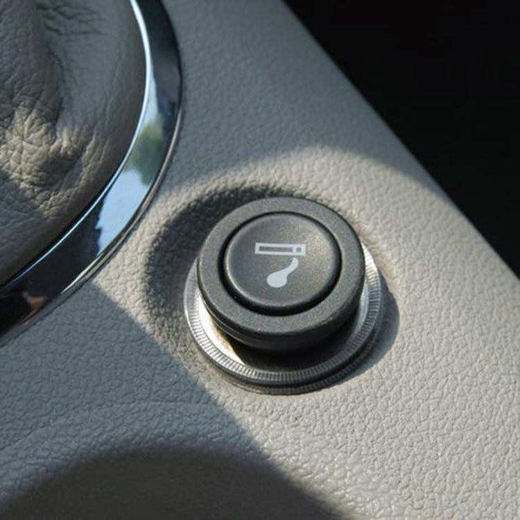 In-car cigarette lighter socket with black button and cup-shaped metal bezel