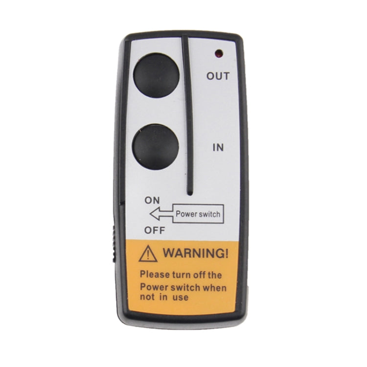 Wireless winch controller remote with OUT/IN indicators and warning label