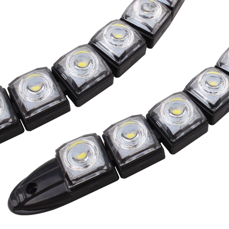 Close-up of black LED modules with square lenses and visible yellow-white LED centers
