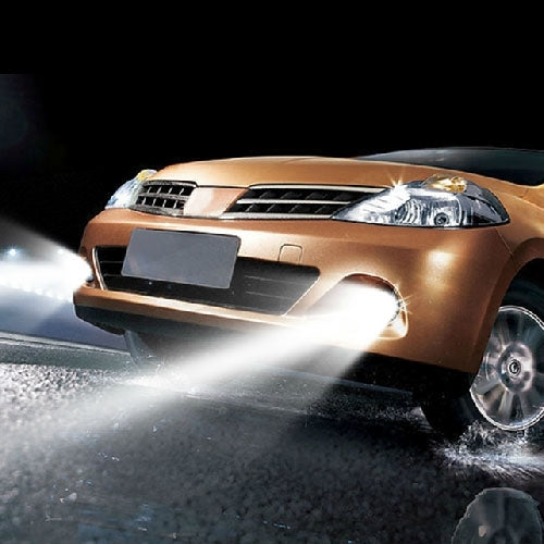 H7 LED fog light bulb producing a bright white beam on car front