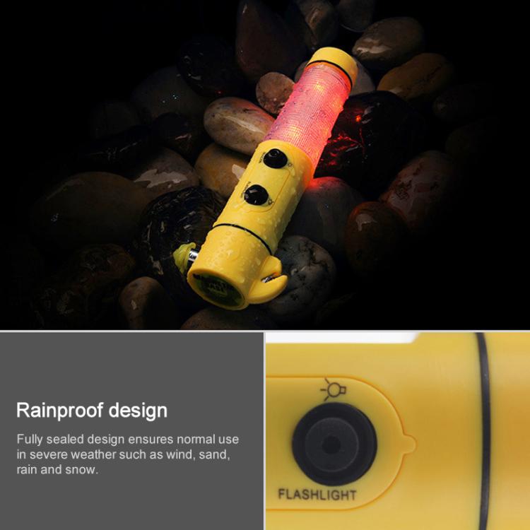 Yellow emergency flashlight with glowing red warning light on textured barrel