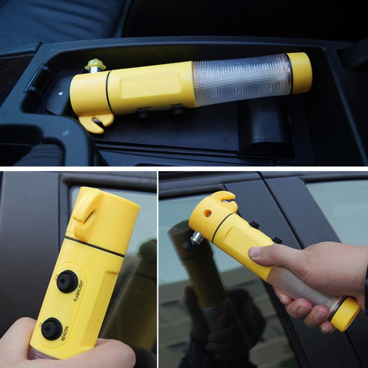Yellow emergency LED flashlight with silver textured tube, shown in a vehicle tray