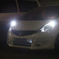 T10 LED clearance lamp producing a bright white beam on a car front