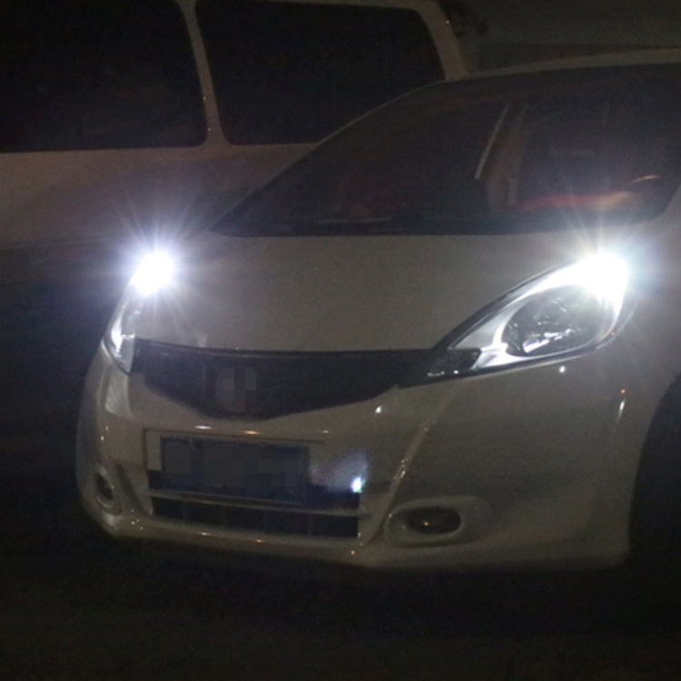 T10 LED clearance lamp producing a bright white beam on a car front