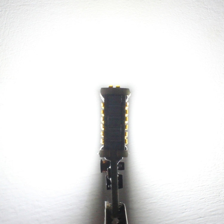Compact T15 LED backup bulb with white LED chips on a black body.