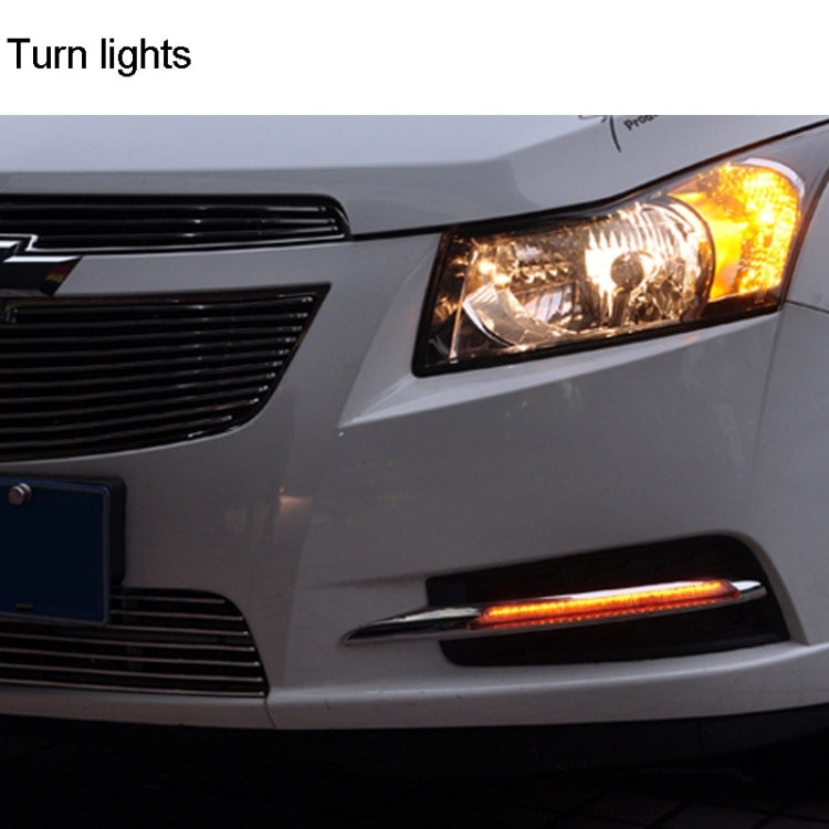 Vehicle front showing illuminated amber turn light strip