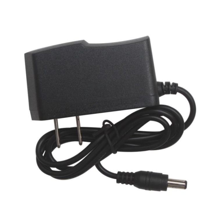 Black power adapter with attached cable and plug